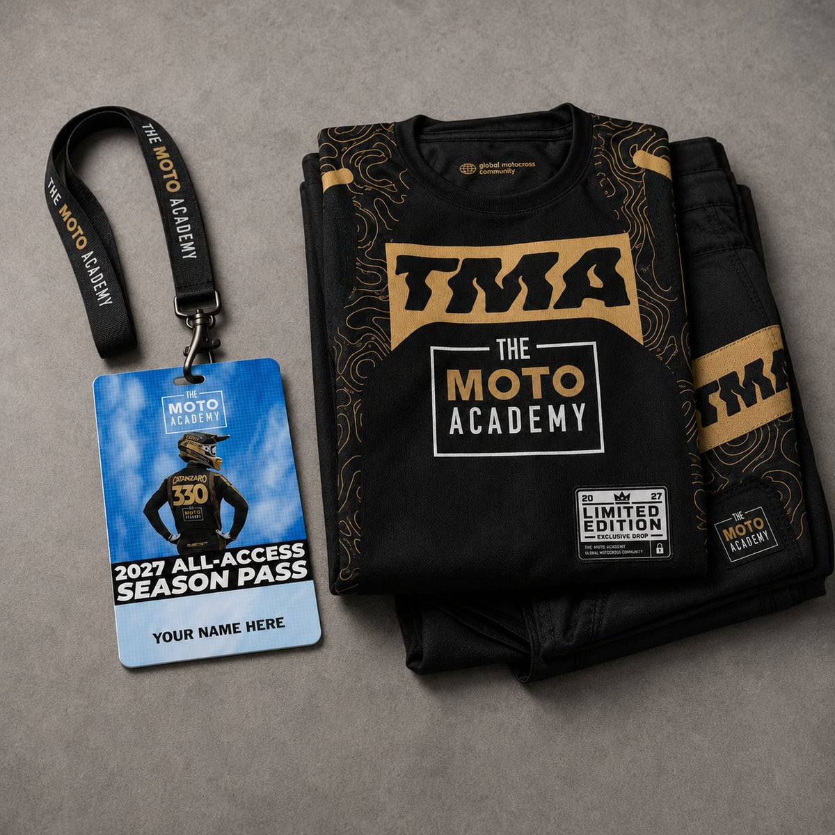 The limited-edition TMA jersey and pants laid out with the personalized 2027 Season Pass hard card and lanyard.