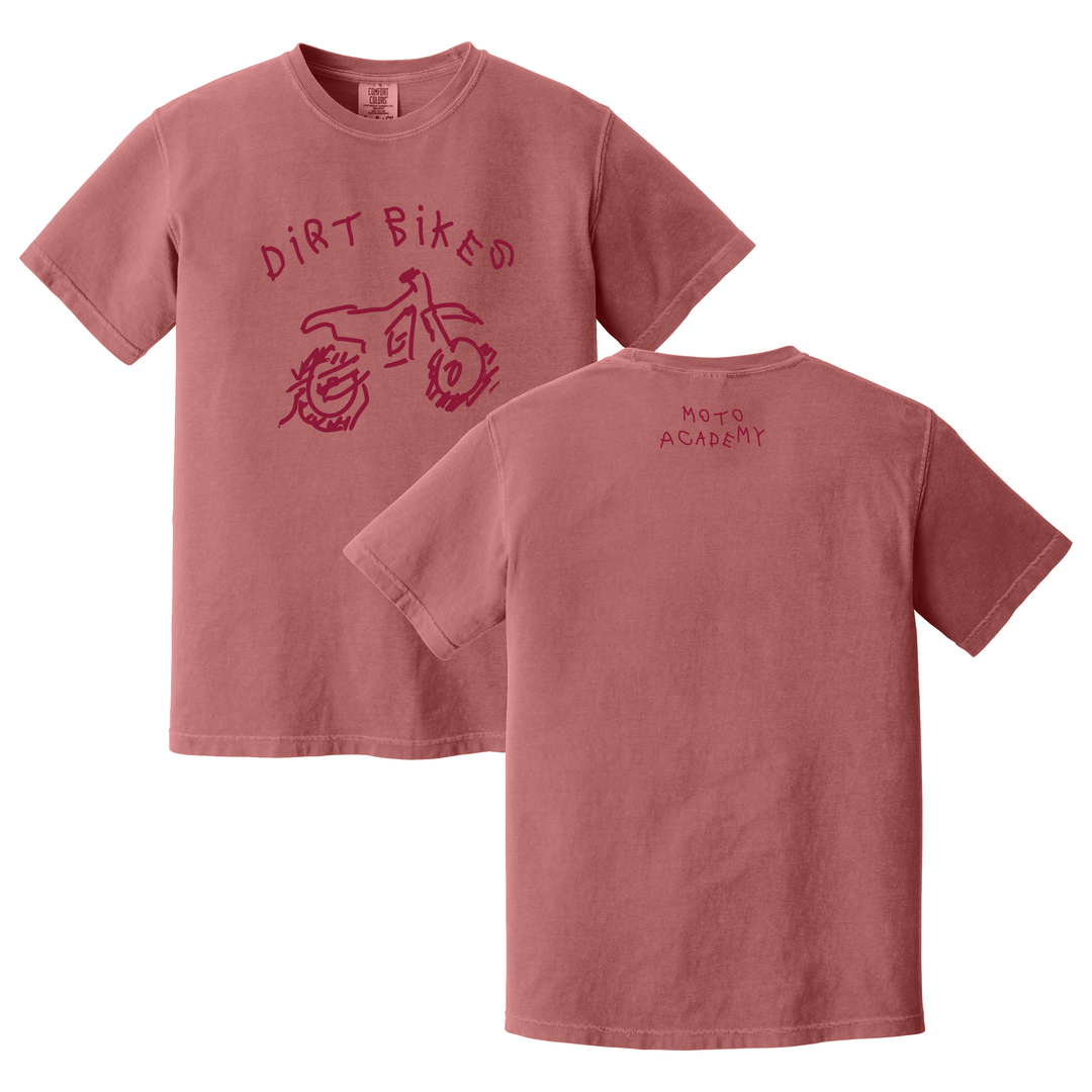 Pink t-shirt with 'Dirt Bikes' graphic on front and 'Moto Academy' text on back, on a white background