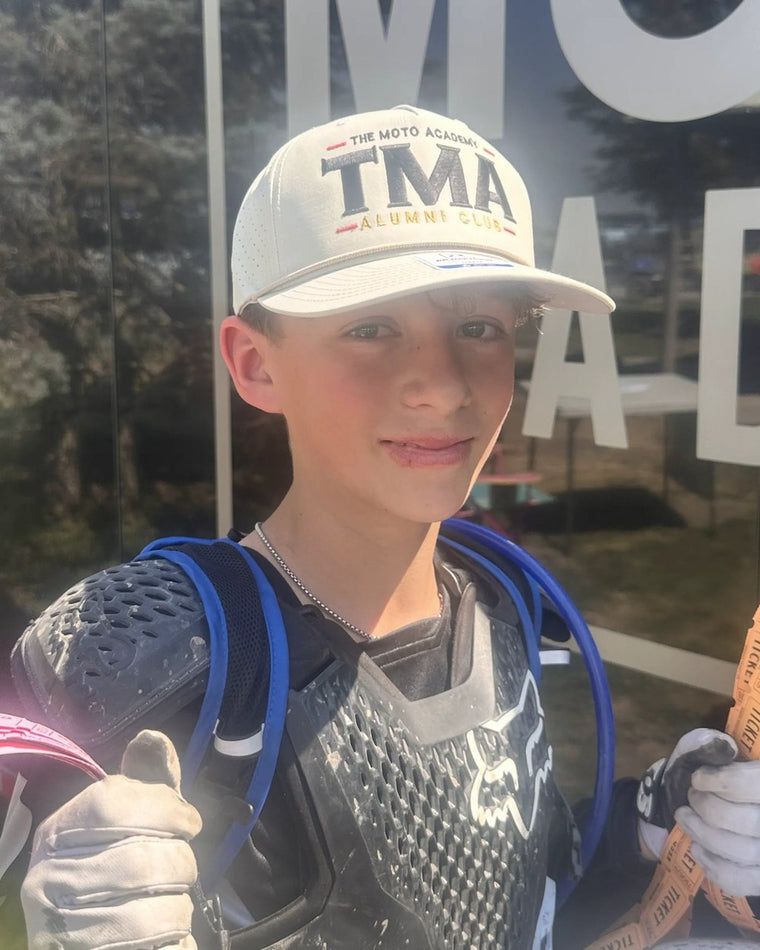 Rider wearing The Moto Academy Alumni Club hat at camp