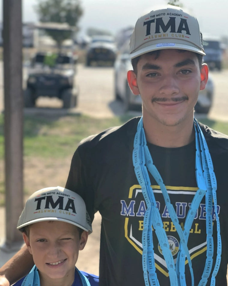 Rider wearing The Moto Academy Alumni Club hat at camp
